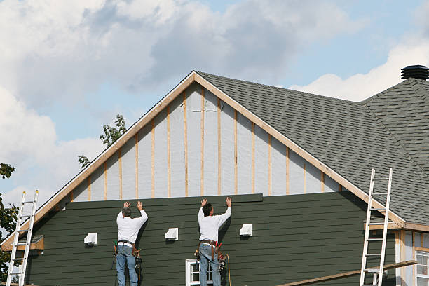 Professional Storm Damage Siding Repair technician working in Paris, IL